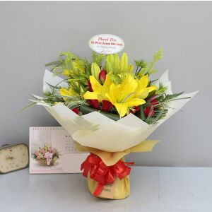 Yellow lilies with red and green